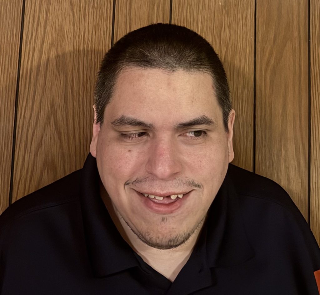 Picture of Co-Founder Josh Mitton wearing a polo